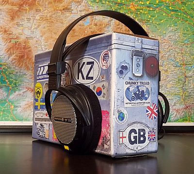headphones on motorbike pannier box with map in the background
